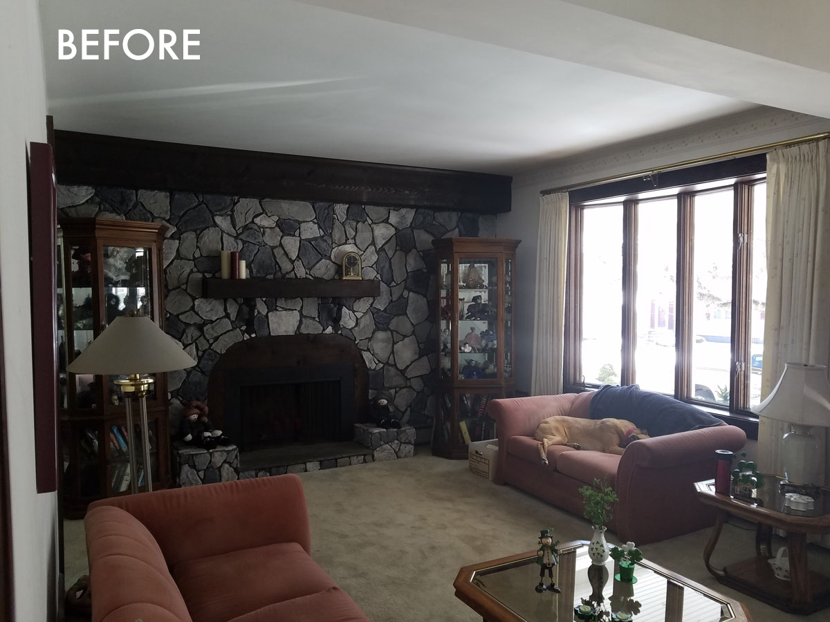 living room with custom stone fireplace