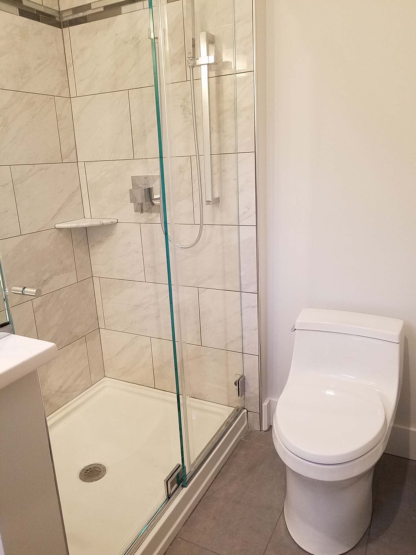 Newly installed toilet and walk in shower