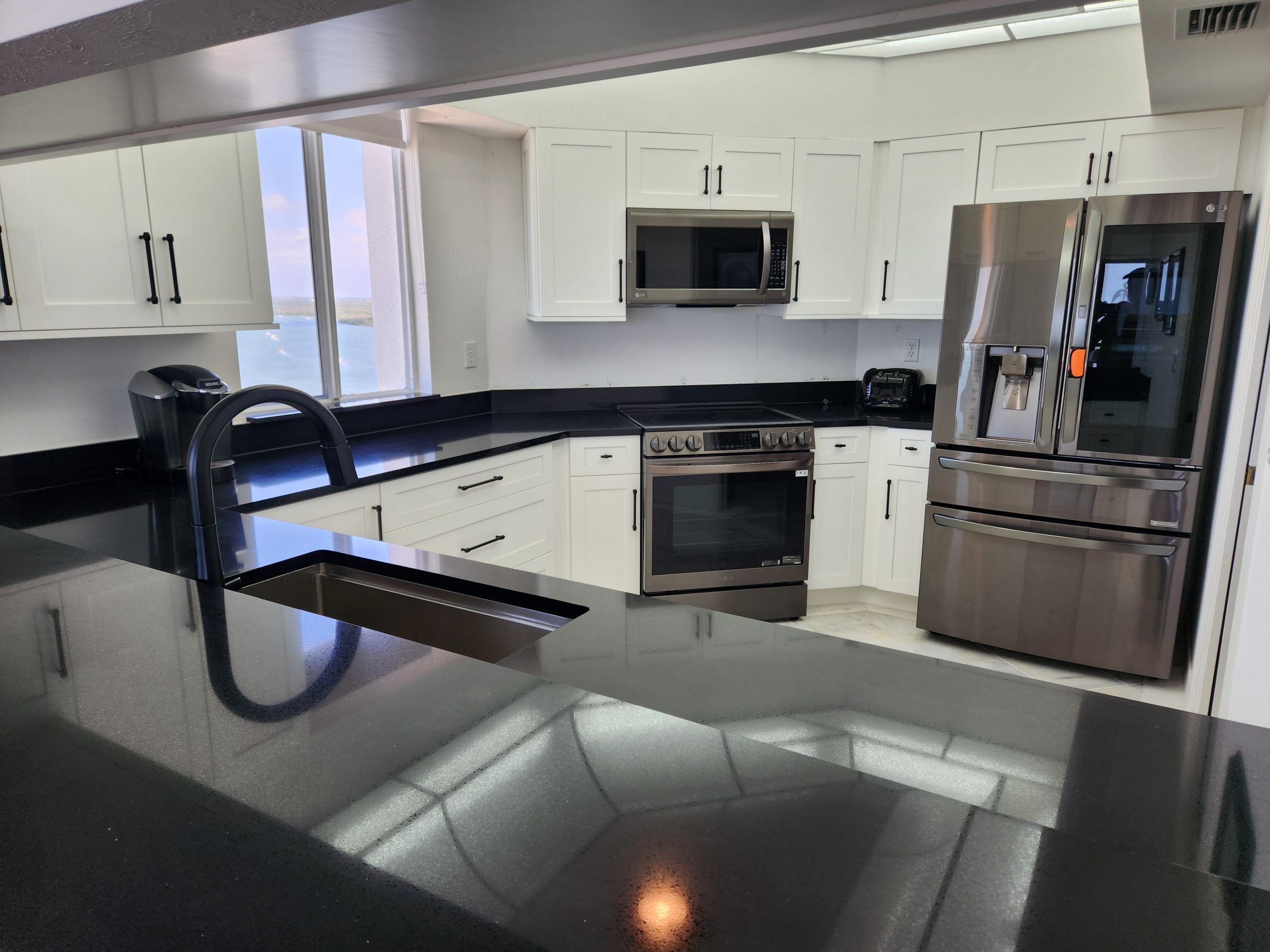 Renovated Kitchen With Countertop & Cabinets